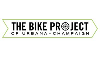 The Bike Project of Urbana-Champaign logo with wheel as 'o' and text inside thin green line arrow shape